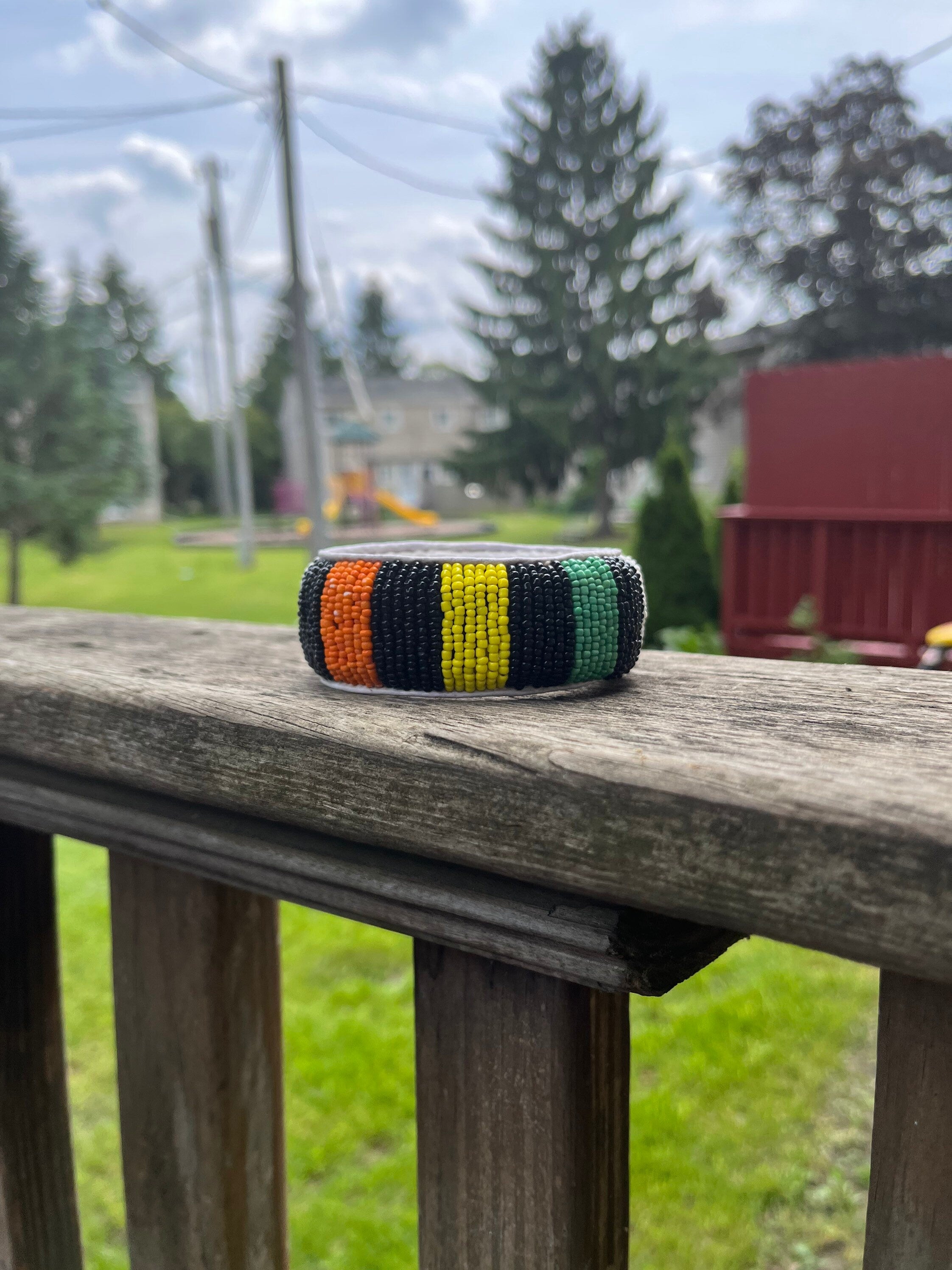 BLACK orange WHITE and GREEN Beaded Bracelet with leather inside made in Mali (West Africa)