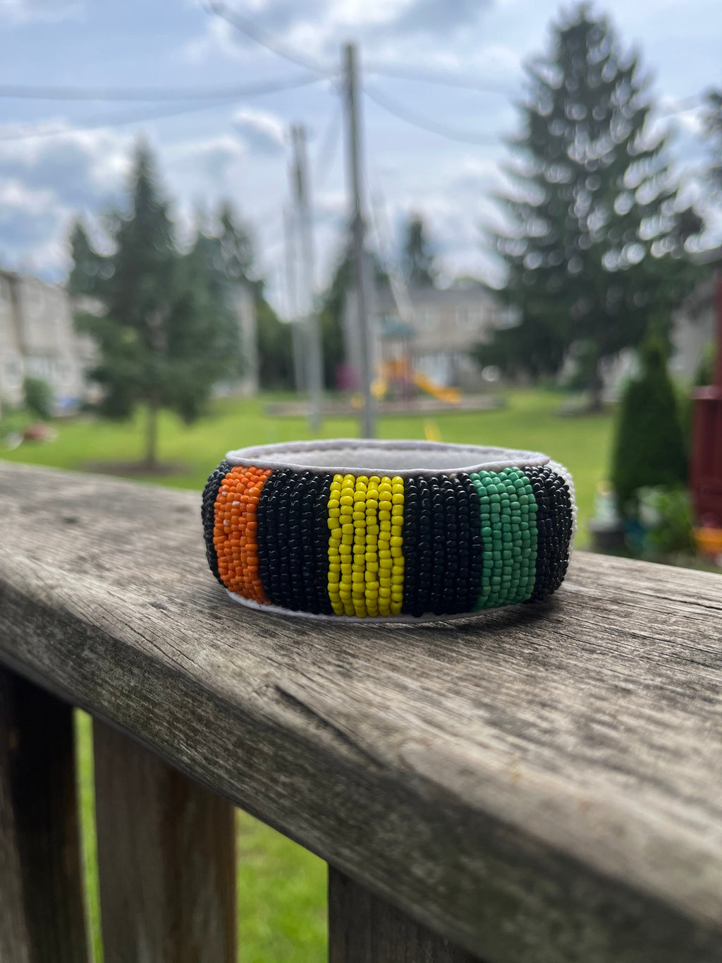 BLACK orange WHITE and GREEN Beaded Bracelet with leather inside made in Mali (West Africa)